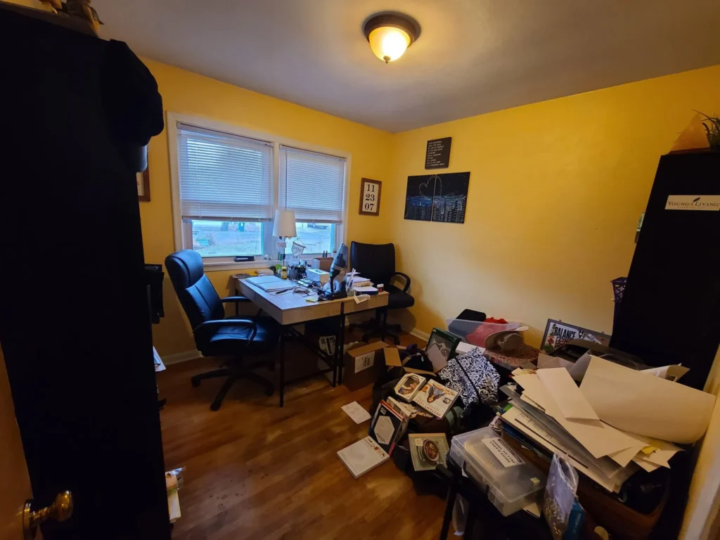 A dump-zone for the family waiting to be used as an office without clutter. 